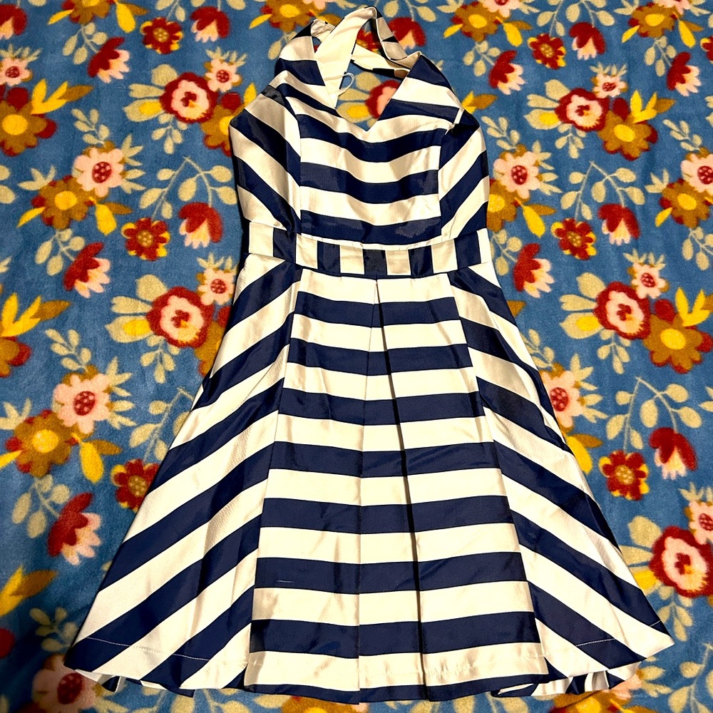 Juniors cream and navy cross back cocktail dress.